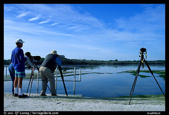 Photographers with big lenses, Ding Darling NWR, Sanibel Island. Florida, USA (color)