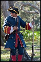 Man useing ramrod on musket, Fort Matanzas National Monument. St Augustine, Florida, USA (color)