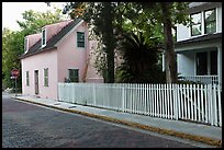 White picket fence and houses on cobblestone street. St Augustine, Florida, USA ( color)