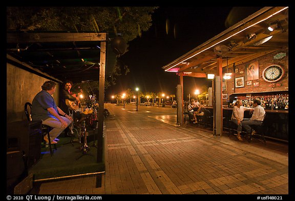 Salsa musicians and bar at night, Mallory Square. Key West, Florida, USA (color)