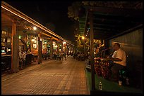 Musicians and restaurant at night, Mallory Square. Key West, Florida, USA