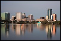 Skyline at dawn from lake Eola. Orlando, Florida, USA