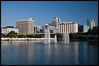 Fountains and morning skyline from Lake Lucerne. Orlando, Florida, USA ( color)