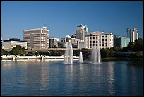 Fountains and morning skyline from Lake Lucerne. Orlando, Florida, USA (color)