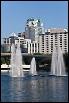 Fountains and downtown high-rises from Lake Lucerne. Orlando, Florida, USA