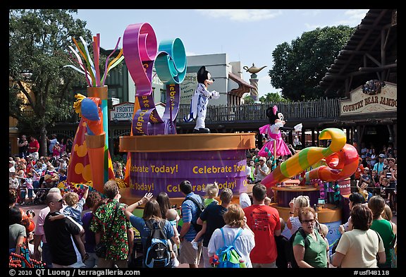 Crowds attends parade with Mickey and Minnie characters. Orlando, Florida, USA