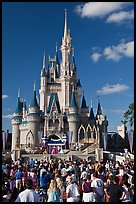 Tourists attend stage musical in front of Cindarella castle. Orlando, Florida, USA (color)