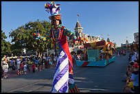 Character on stilts during parade, Main Street. Orlando, Florida, USA (color)