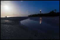 Lighthouse beach with family in distance and moonlight, Sanibel Island. Florida, USA (color)