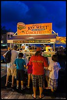 Key lime and conch fritters food stand at night. Key West, Florida, USA (color)