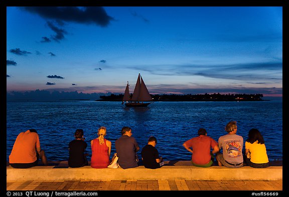 Tourists watching ocean after sunset, Mallory Square. Key West, Florida, USA (color)