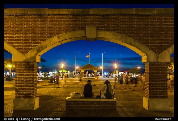 Mallory Square at dust seen through arches. Key West, Florida, USA