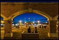 Mallory Square at dust seen through arches. Key West, Florida, USA ( color)