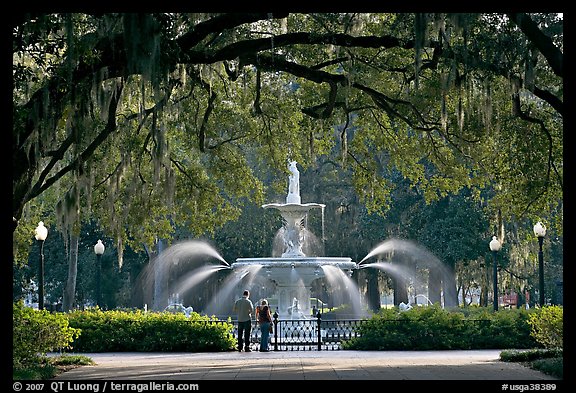 Fountain in Forsyth Park with couple standing. Savannah, Georgia, USA (color)