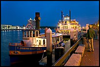 Ferry and riverboat on Savannah River at dusk. Savannah, Georgia, USA