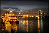 Riverboat and Savannah Bridge at dusk. Savannah, Georgia, USA