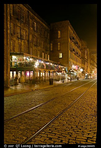 Brick and cobblestone waterside street by night. Savannah, Georgia, USA (color)