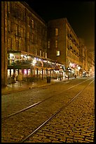 Brick and cobblestone waterside street by night. Savannah, Georgia, USA