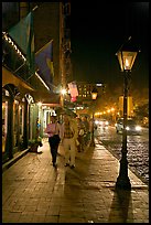 People on sidewalk of River Street by night. Savannah, Georgia, USA (color)