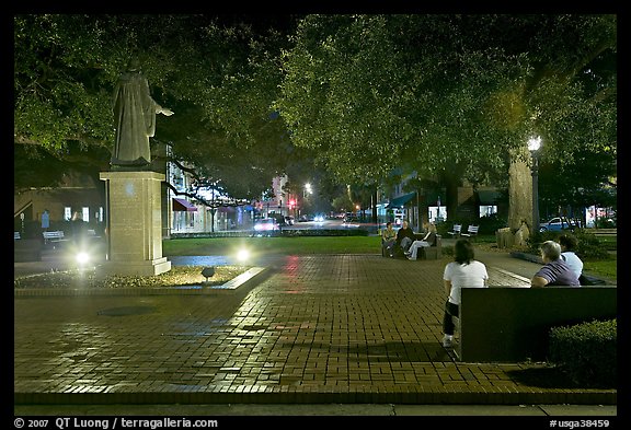 Square by night with people sitting on benches. Savannah, Georgia, USA (color)