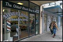 Women walking in front of oldest black shop in Atlanta. Atlanta, Georgia, USA