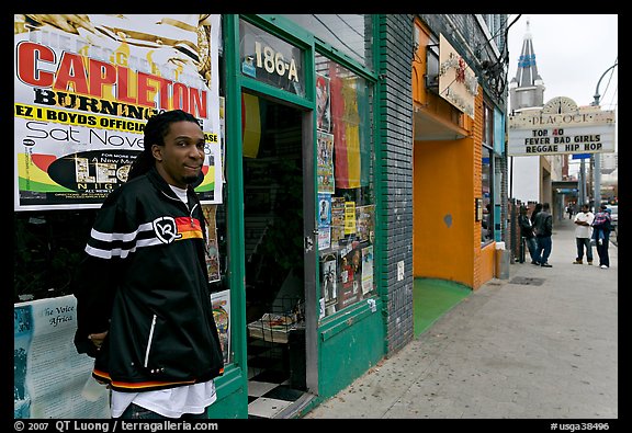 Man standing in front of music store, sweet Auburn. Atlanta, Georgia, USA (color)