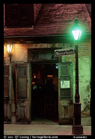 Cafe on Bourbon street at night, French Quarter. New Orleans, Louisiana, USA