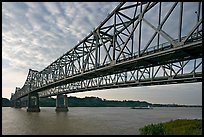 Barge on the Mississippi River approaching bridges. Natchez, Mississippi, USA ( color)