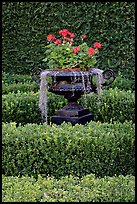 Vasque with flowers and spanish moss in garden. Natchez, Mississippi, USA (color)