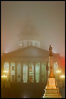 Monument and state capitol in fog at night. Columbia, South Carolina, USA