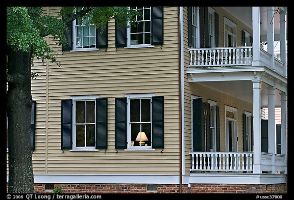 House with lamp inside window. Columbia, South Carolina, USA