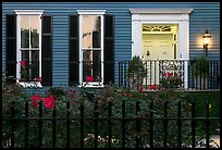 House facade at dusk with roses in front yard. Charleston, South Carolina, USA ( color)