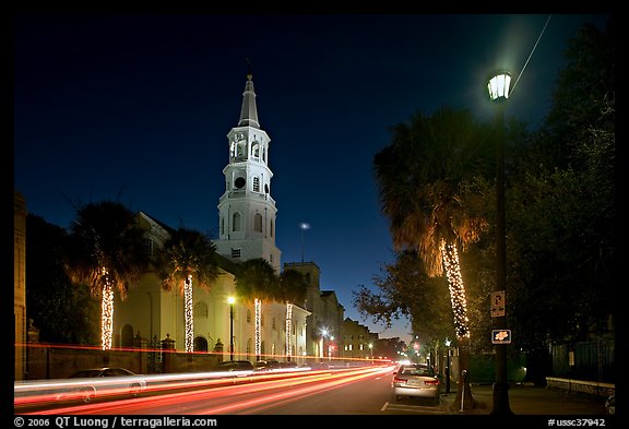 St Michael Episcopal Church and street with traffic at night. Charleston, South Carolina, USA