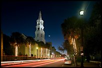 St Michael Episcopal Church and street with traffic at night. Charleston, South Carolina, USA (color)