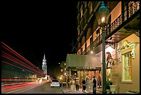 Street, church, and Mills house hotel with many guests at night. Charleston, South Carolina, USA