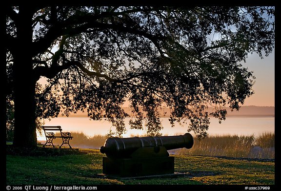 Cannon, and bench overlooking Beaufort Bay at sunrise. Beaufort, South Carolina, USA