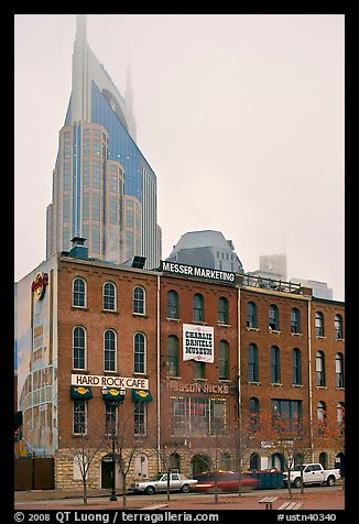 Row of brick buildings and Bell South Tower in fog. Nashville, Tennessee, USA