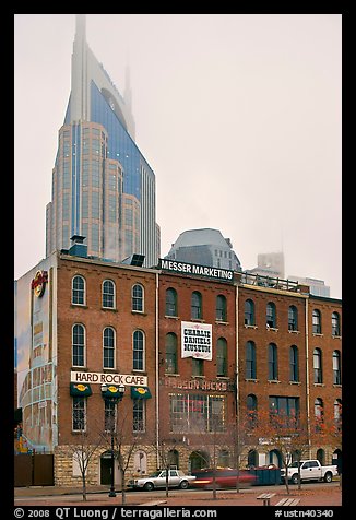 Row of brick buildings and Bell South Tower in fog. Nashville, Tennessee, USA (color)