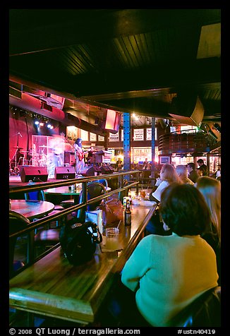 Patrons listen to musical performance in Beale Street bar. Memphis, Tennessee, USA