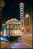 Trolley and Orpheum theater sign by night. Memphis, Tennessee, USA