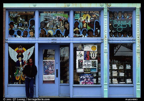 African-American man standing in front of blue storefront on Beal street. Memphis, Tennessee, USA