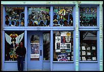 African-American man standing in front of blue storefront on Beal street. Memphis, Tennessee, USA