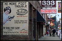 Old advertising on brick building and sidewalk, Beale street. Memphis, Tennessee, USA (color)