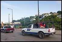 Residents riding in back of pick-up trucks, Cruz Bay. Saint John, US Virgin Islands ( color)