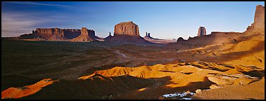 Monument Valley late afternoon scenery with shadows. Monument Valley Tribal Park, Navajo Nation, Arizona and Utah, USA (Panoramic color)