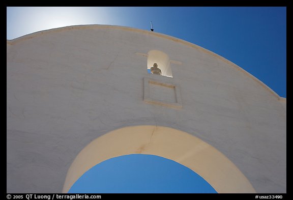 Backlit whitewashed arch, San Xavier del Bac Mission. Tucson, Arizona, USA