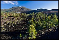 Volcanic hills covered with black lava and cinder. Sunset Crater Volcano National Monument, Arizona, USA