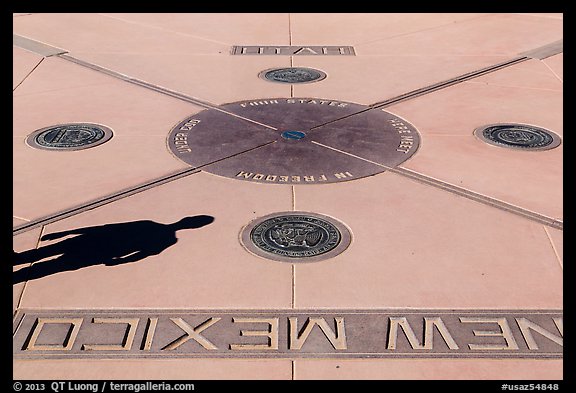 Shadow and state seals. Four Corners Monument, Arizona, USA (color)