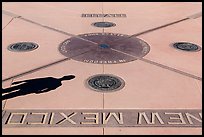 Shadow and state seals. Four Corners Monument, Arizona, USA (color)