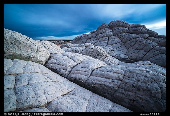 Buttes with crossbeded white sandstone layer, evening. Vermilion Cliffs National Monument, Arizona, USA (color)